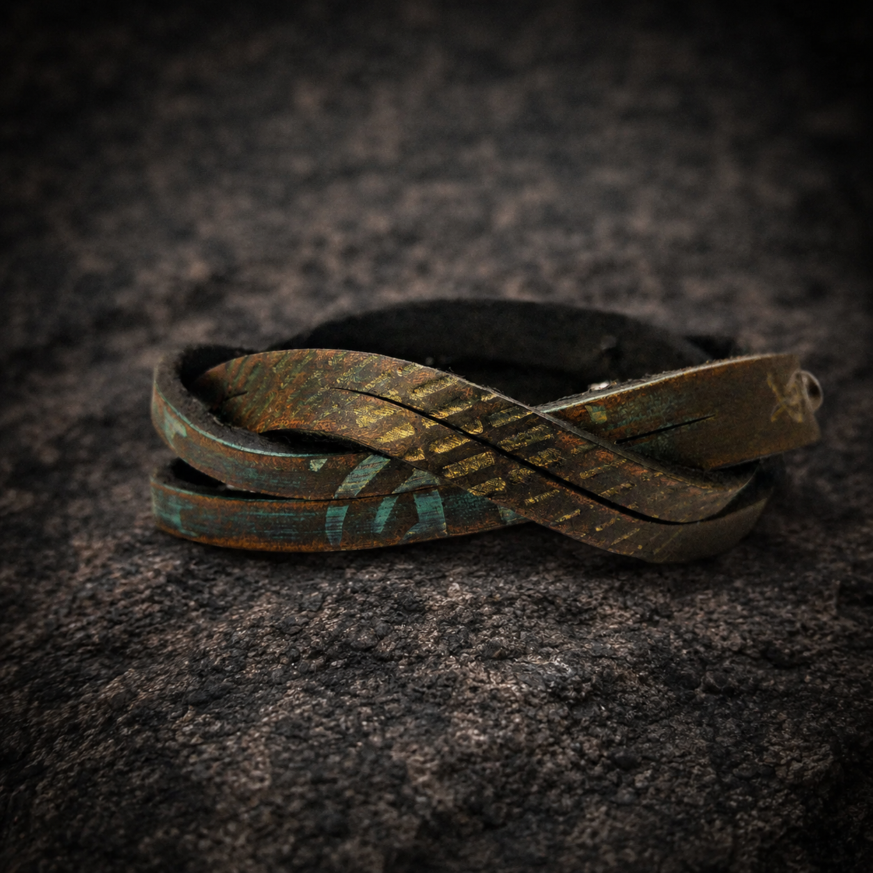 Brown leather wrap bracelet with golden and turquoise engraving and a silver clasp
