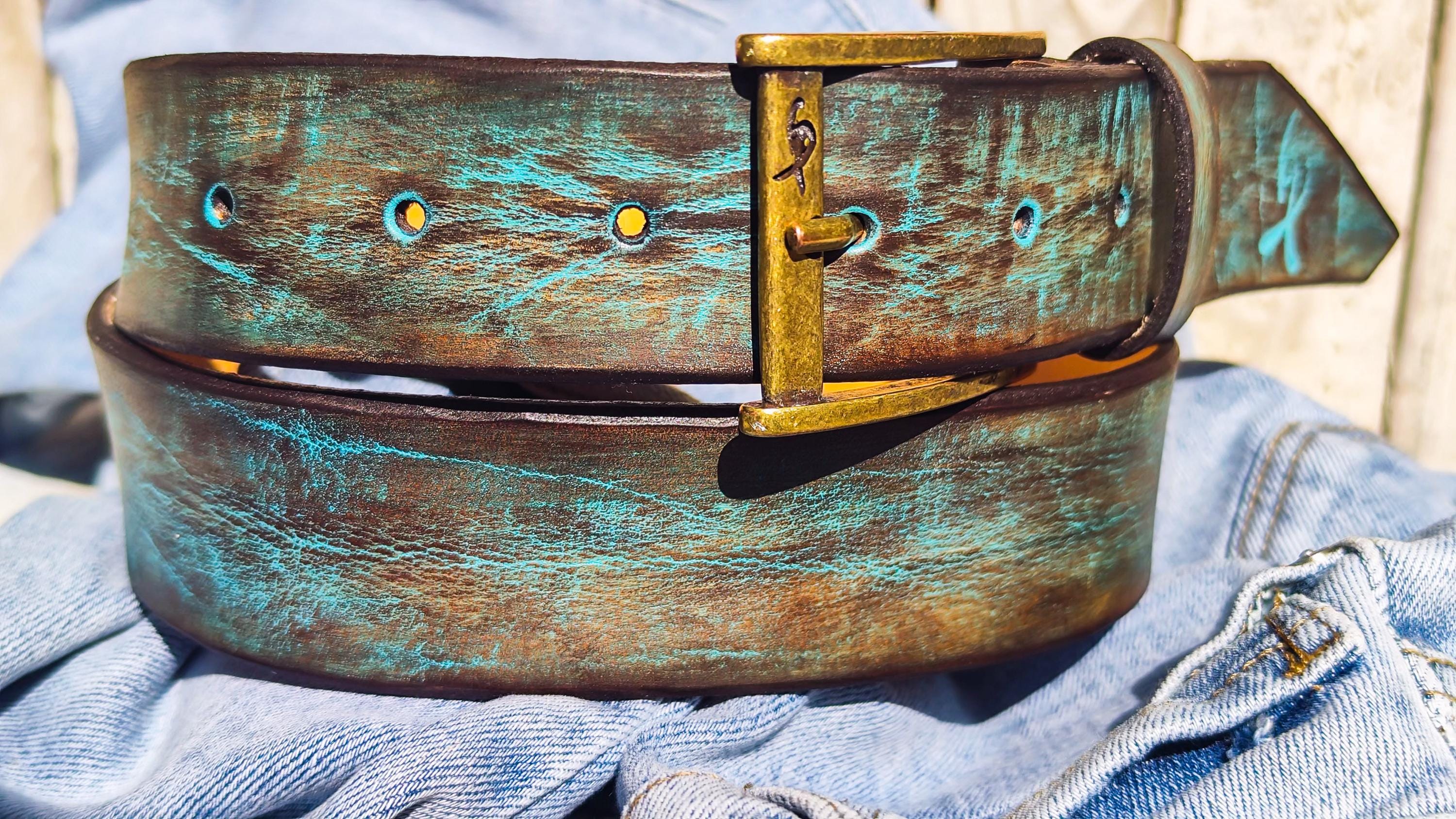Rustic turquoise and brown leather belt with antique brass buckle.