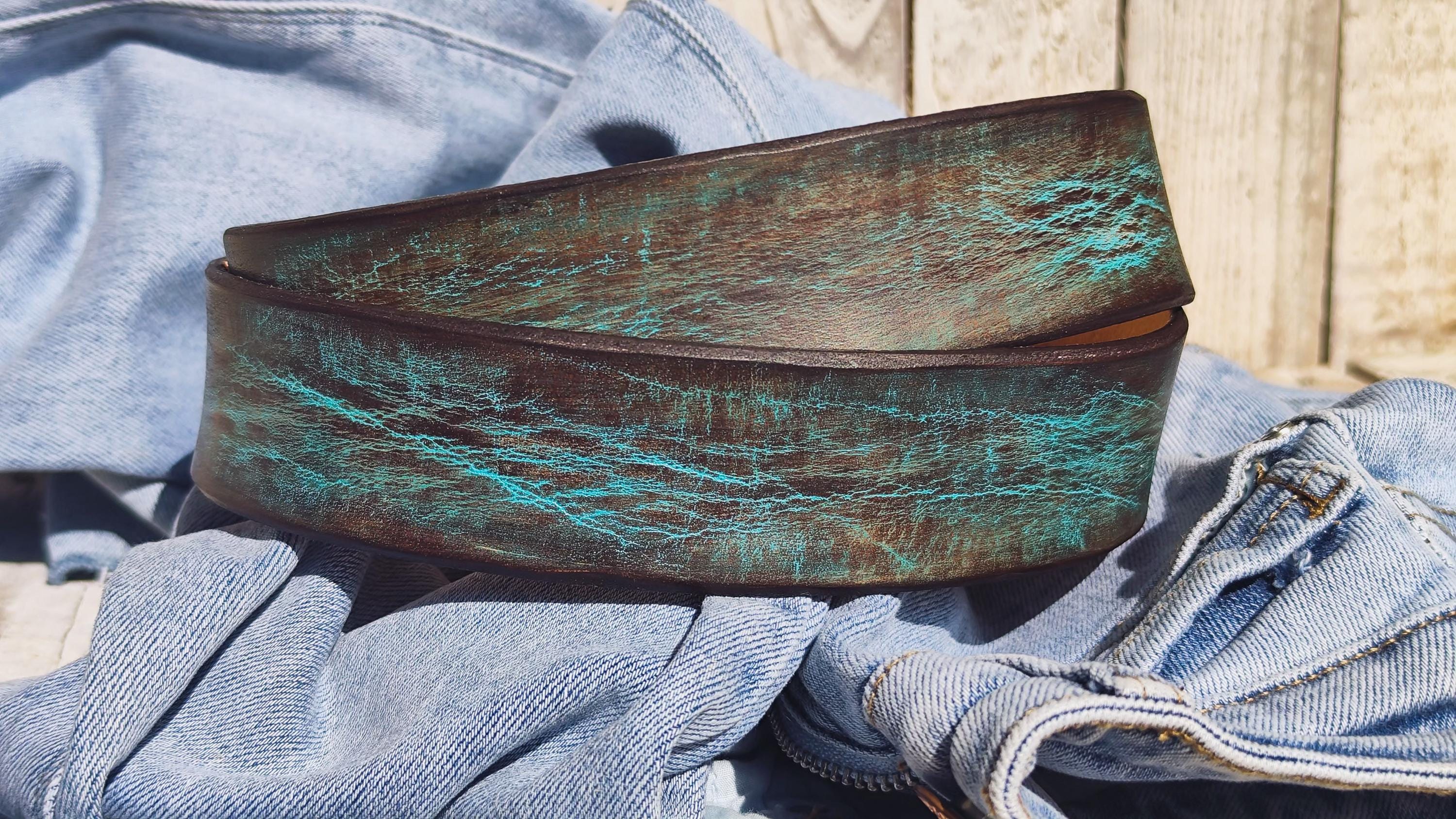 Bold turquoise and brown leather belt wrapped in casual denim.