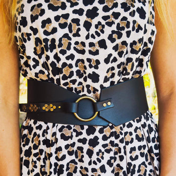 Black leather waist belt with asymmetrical design and bronze Ring. Black dress corset for women, wide leather belt