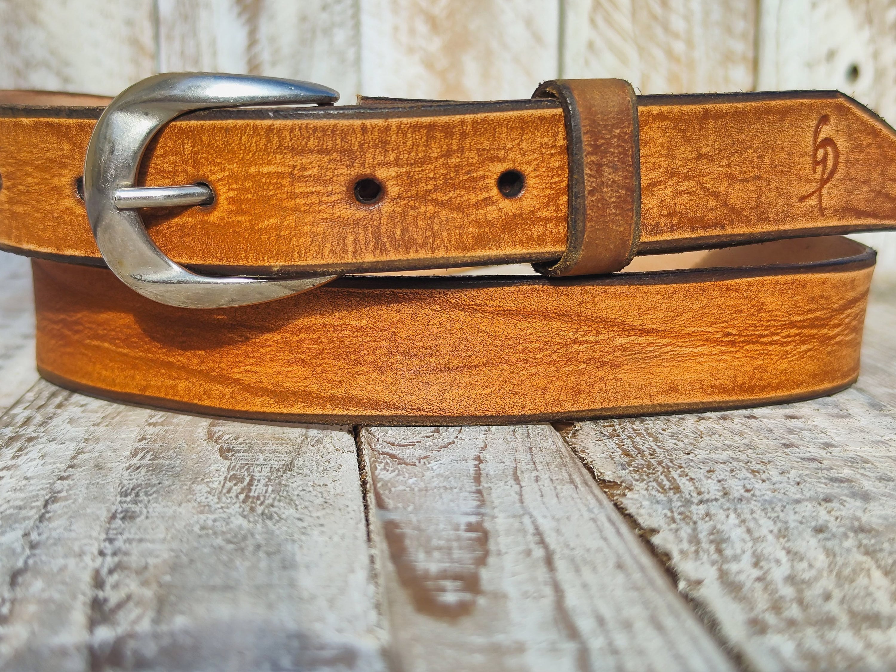 Light Brown Narrow Leather Belt with Silver Buckle Perfect for Everyday Wear and Pairing with Jeans