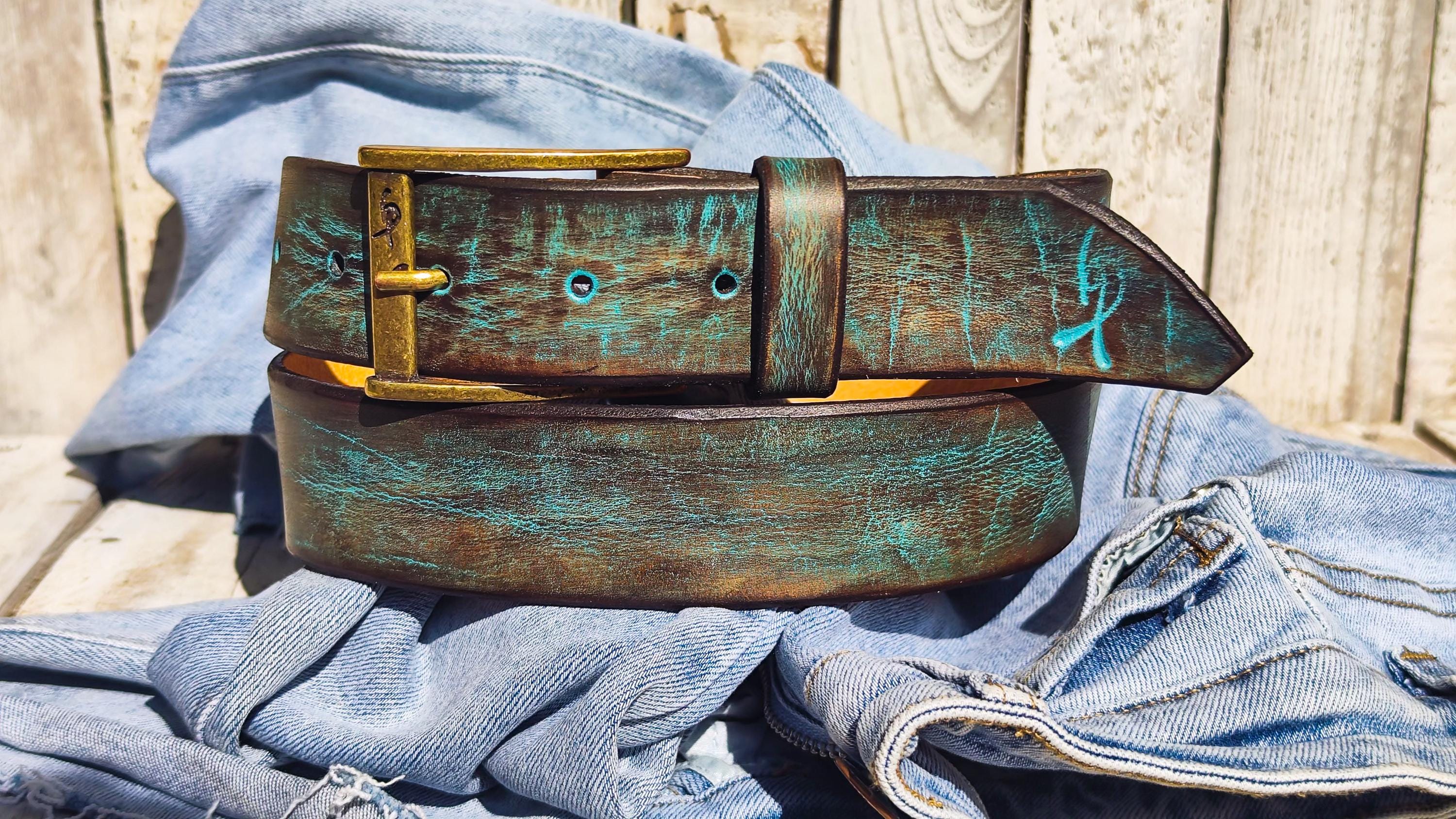 Bold turquoise and brown leather belt wrapped in casual denim.