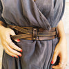 Brown leather waist belt with that has a unique decorative cord closure, perfect belt to wear with dress or jacket.