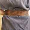 Brown leather waist belt with that has a unique decorative cord closure, perfect belt to wear with dress or jacket.