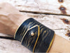 Wide black leather wrap bracelet with gold wash elegant statement bracelet design with unique geomtric shape and option to personalized