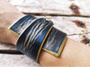 Wide black leather wrap bracelet with gold wash elegant statement bracelet design with unique geomtric shape and option to personalized