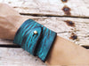 Wide turquoise leather wrap bracelet with brown wash design with  geomtric shape and personalizable option, the perfect christmas gift