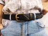 A black hammered leather belt with touch of gold embossed with computer card unique design by ishaor the perfect christmas gift with name on