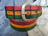 Leather belt designed in African colors, red, yellow and green with a brown wash and belt tail with a crocodile texture