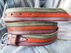 A colorful and summery belt made from three layers of pastel colors orange turquoise and purple  fits with jeans and refreshes any outfit