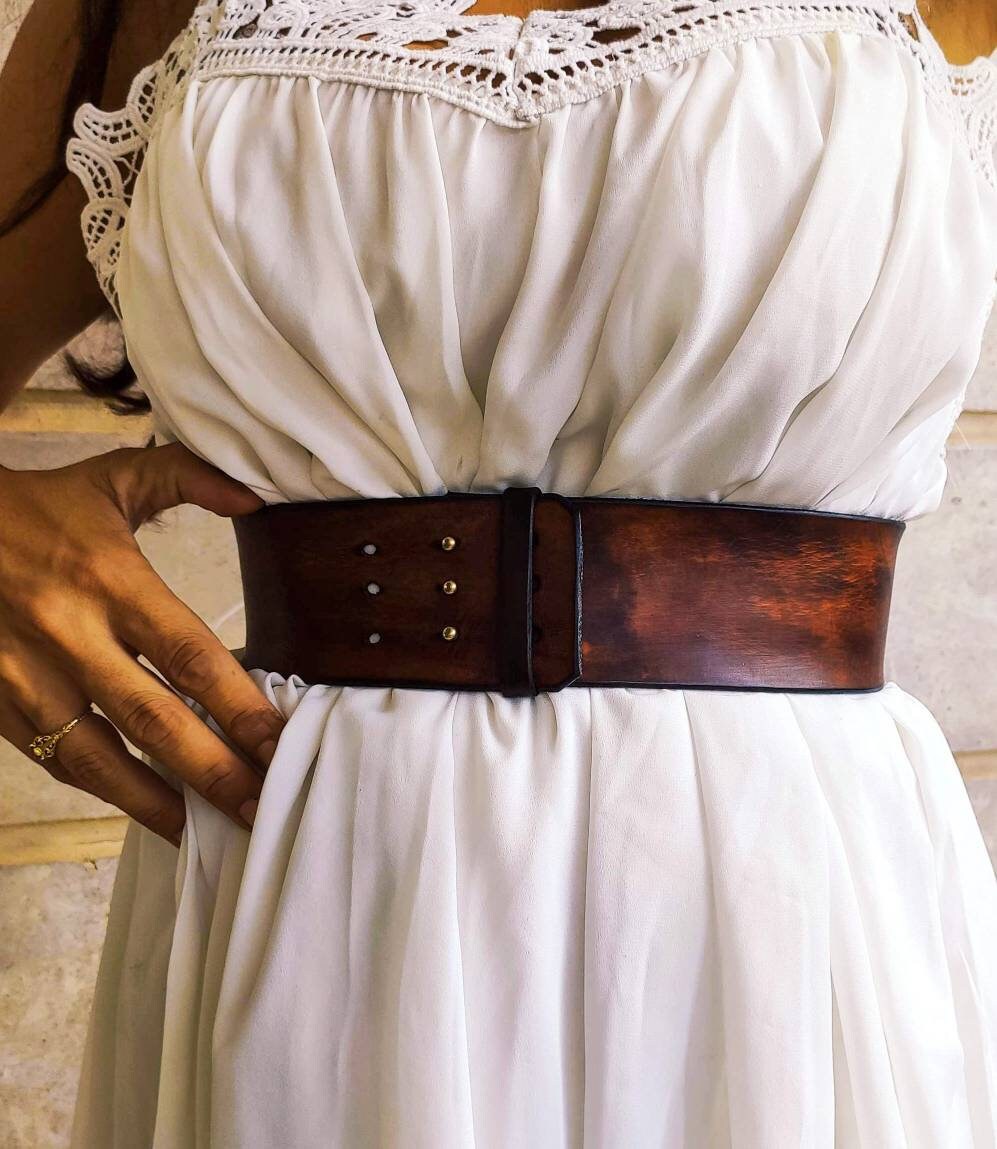 Brown leather waist belt with that has a unique decorative cord closure, perfect belt to wear with dress or jacket. vintage waist belt .