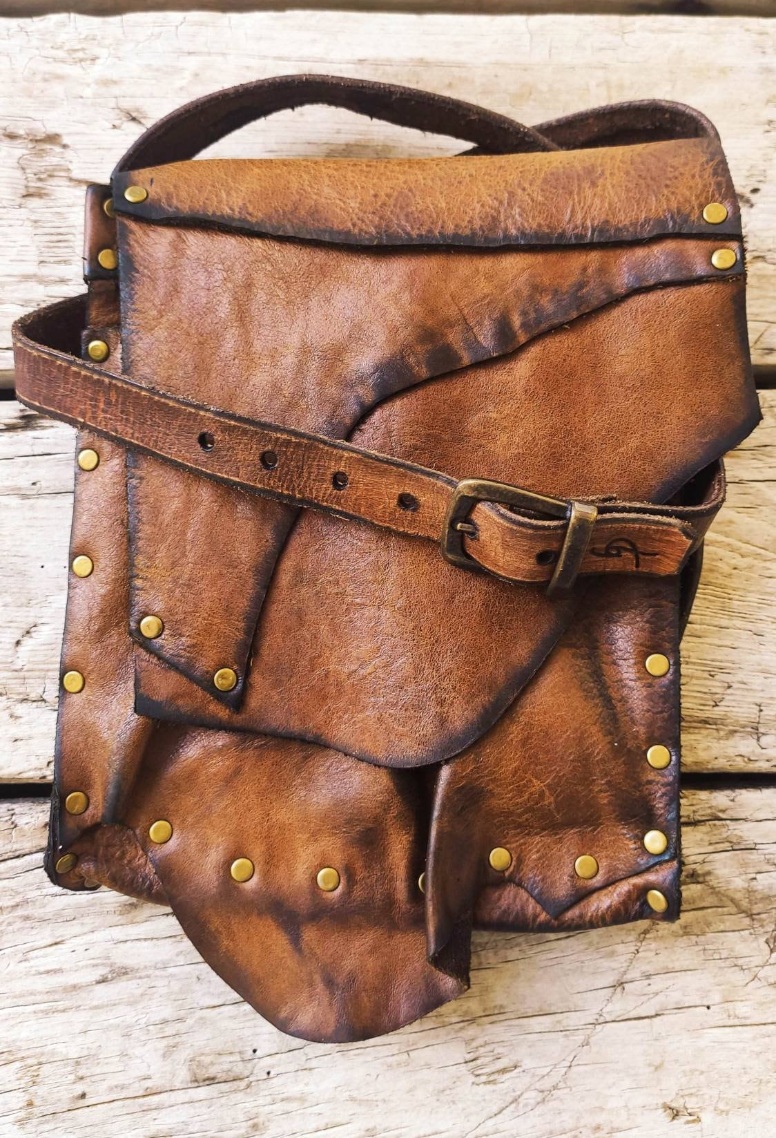 worn leather bag